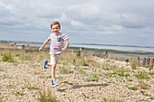 Boy running on the beach