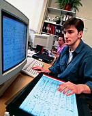 Genome researcher working with computer