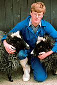Scientist with genetically-cloned sheep