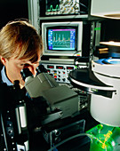 Biologist performing electrophysiology experiment