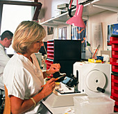 Researcher uses a microtome to cut tissue samples