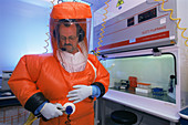Virologist using a protective suit
