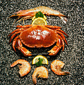 Shellfish; crab and prawns with lemon garnish