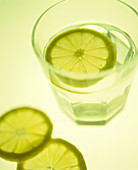 Glass of water with sliced lemon