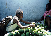 Girl buying mangoes