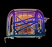 Coloured X-ray of pop-up toaster with toast inside
