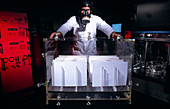 Technician with paper used in preservation tests
