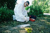 Forensics officer taking a footprint cast