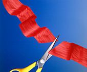 Scissors cutting red ribbon tape