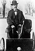 Henry Ford riding on his 1896 motor quadricycle