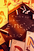 Test answers including E=mc2 on a blackboard