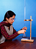 Student performing titration