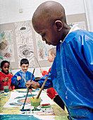 Boy painting at school