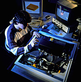 Technician working on an atomic force microscope