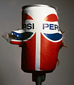 High-speed photo of bullet hitting Pepsi can