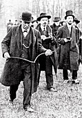 Man using a dowsing rod in the early 20th century