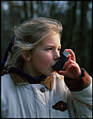 Girl using inhaler