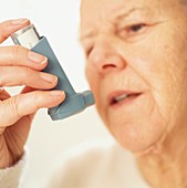 Woman using an inhaler