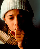 Common cold: young girl coughing