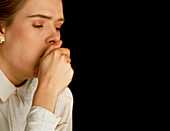 Young woman coughing due to common cold infection