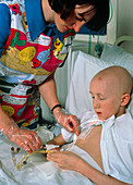 Young boy undergoing chemotherapy for leukaemia