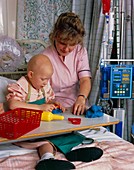 Child with Ewing's sarcoma playing in a nursery