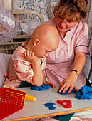 Child with Ewing's sarcoma in an hospital nursery