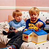 A child with Down's syndrome playing with a friend