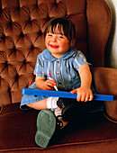 Four year old girl with Down's syndrome playing