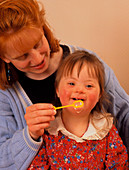 3-year-old girl with Down's syndrome with bubbles