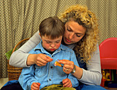 Boy with Down's syndrome with mum