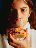 Eating disorder: girl with tape over her mouth