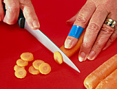 Detectable plaster on a cut finger