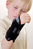 Boy wearing a wrist support