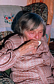 Elderly woman crying