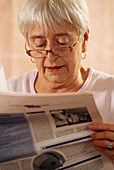 Elderly woman reading