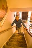 Elderly man climbing stairs