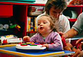Cerebral palsy child in supportive chair