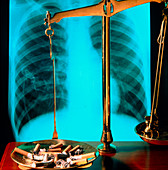 Scales with cigarettes,lung X-ray in background