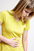 Young woman with abdominal pain