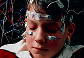 Boy having EEG examination