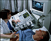 Doppler ultrasound scanning of a man's abdomen