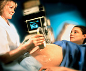 Ultrasound scanning of a pregnant woman's abdomen