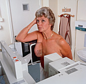 Woman patient undergoing medio-lateral mammography
