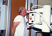 Man swallowing barium during an X-ray examination