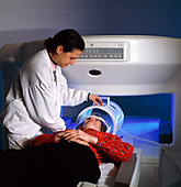 Woman prepared for entering a wide MRI scanner