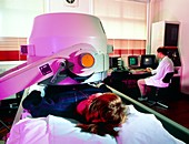 Person undergoing liver scan using a gamma camera