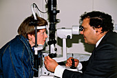 Slit-lamp examination of a woman's eyes