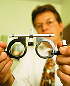 Optician with eye test frames
