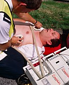 Ambulanceman treating heart patient